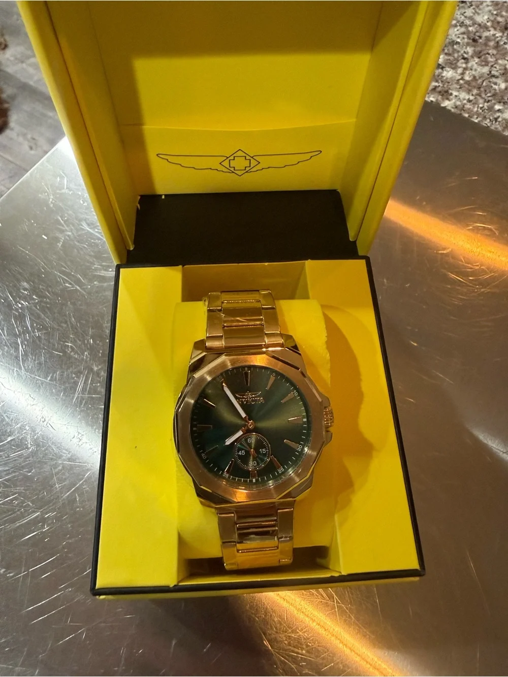 Invicta Gold Tone Watch with Blue-Green Dial